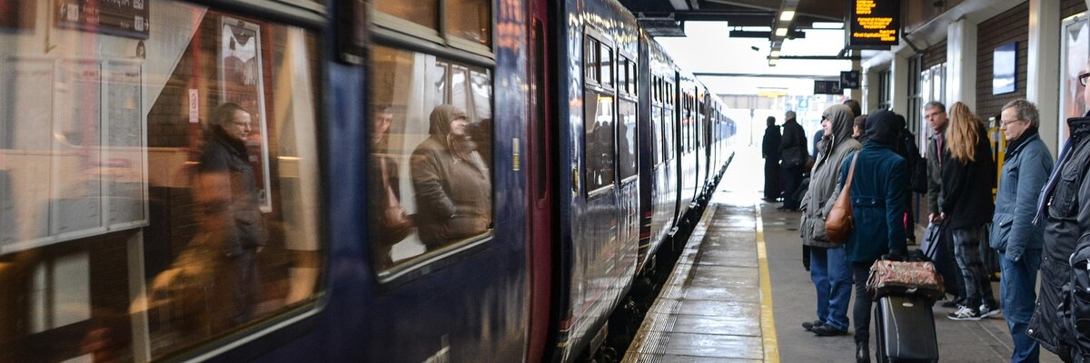 Passengers boarding a train beside a platform