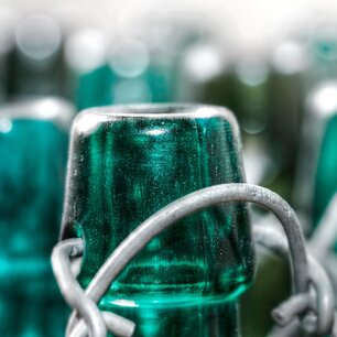 Green glass bottles bundled with wire