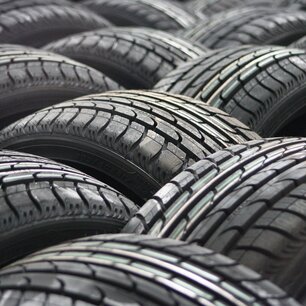 Stacks of car tires piled in rows
