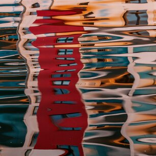 Abstract reflections rippling across water