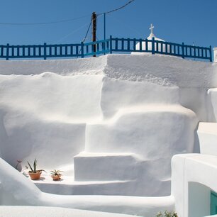 Whitewashed cliffside village overlooking the sea