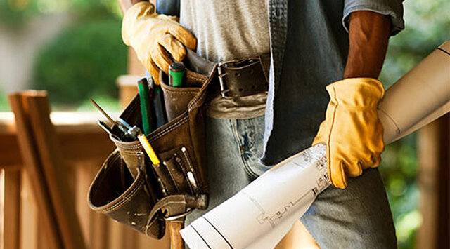 Sample showcase photo: a tool belt holding rolled plans