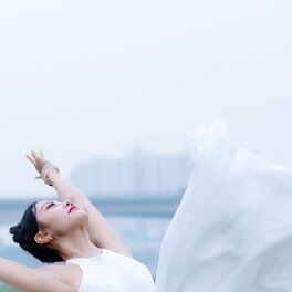 Sample portrait: a dancer captured mid-leap, face turned skyward