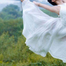 Sample portrait: a detail crop of flowing fabric, no face in frame