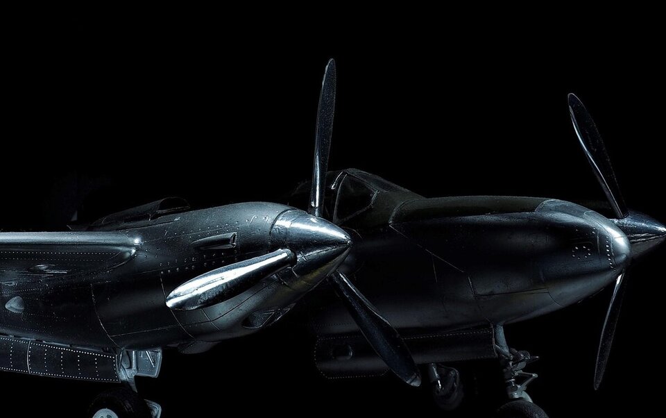 Close-up crop of the twin-engine aircraft from the hero photo