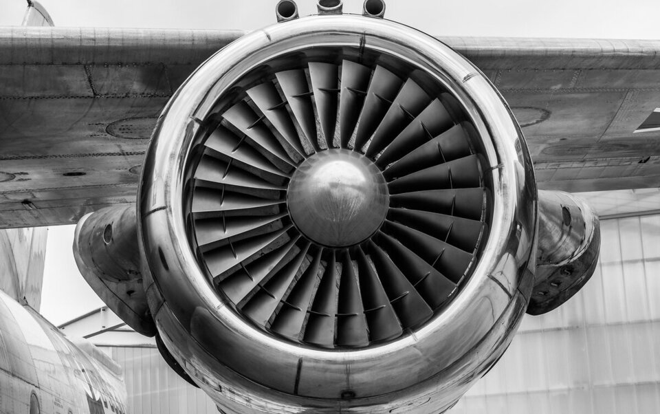 Close-up of a jet turbine engine in black and white